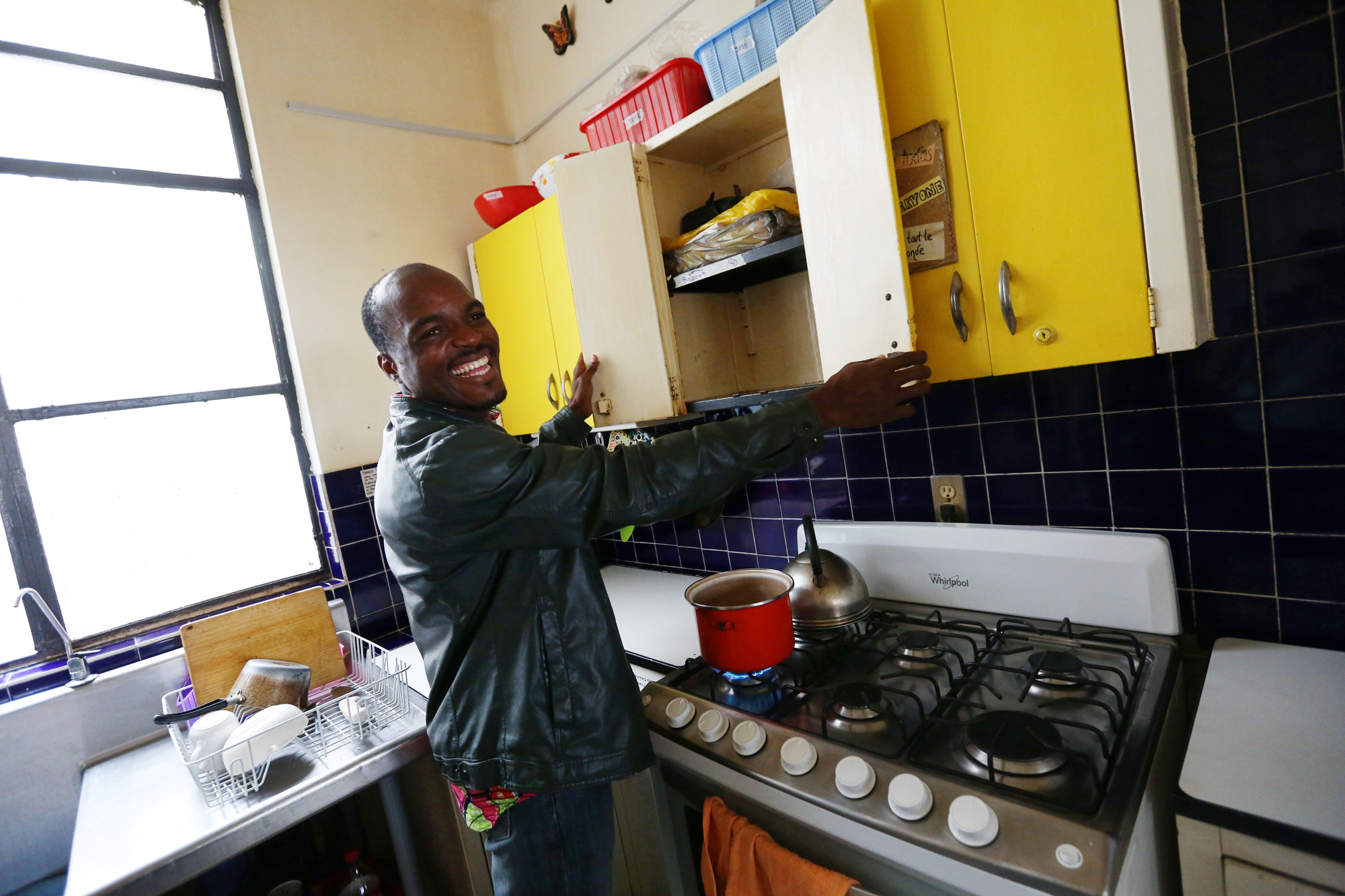 Patrick in the kitchen at Casa de los Amigos, where he used to prepare meals and enjoy time with other migrants and refugees as they adjusted to life in Mexico City. Nina Linton