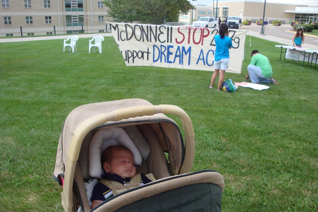 Dream Act with baby Gabriel [DREAM Act Advocacy at James Madison University in Harrisonburg, Virginia. Infant is Gabriel Jantzi, young woman is DREAM Activist Virginia founder Isabel Castillo]. Elizabeth Phelps. 