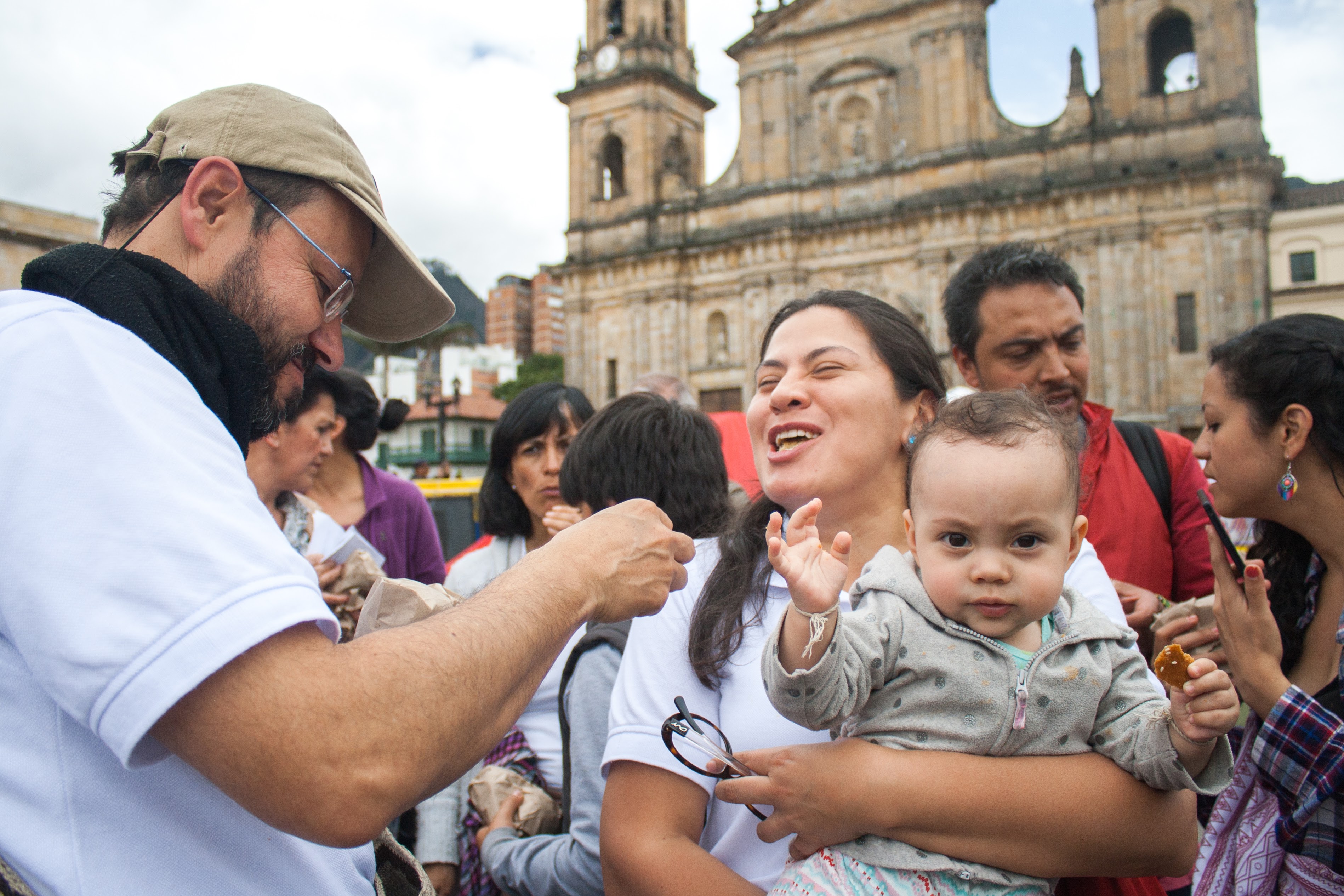 Jenny Neme of Justpaz receives communion bread in the plaza during an ecumenical service for peace after the plebiscite. Anna Vogt.