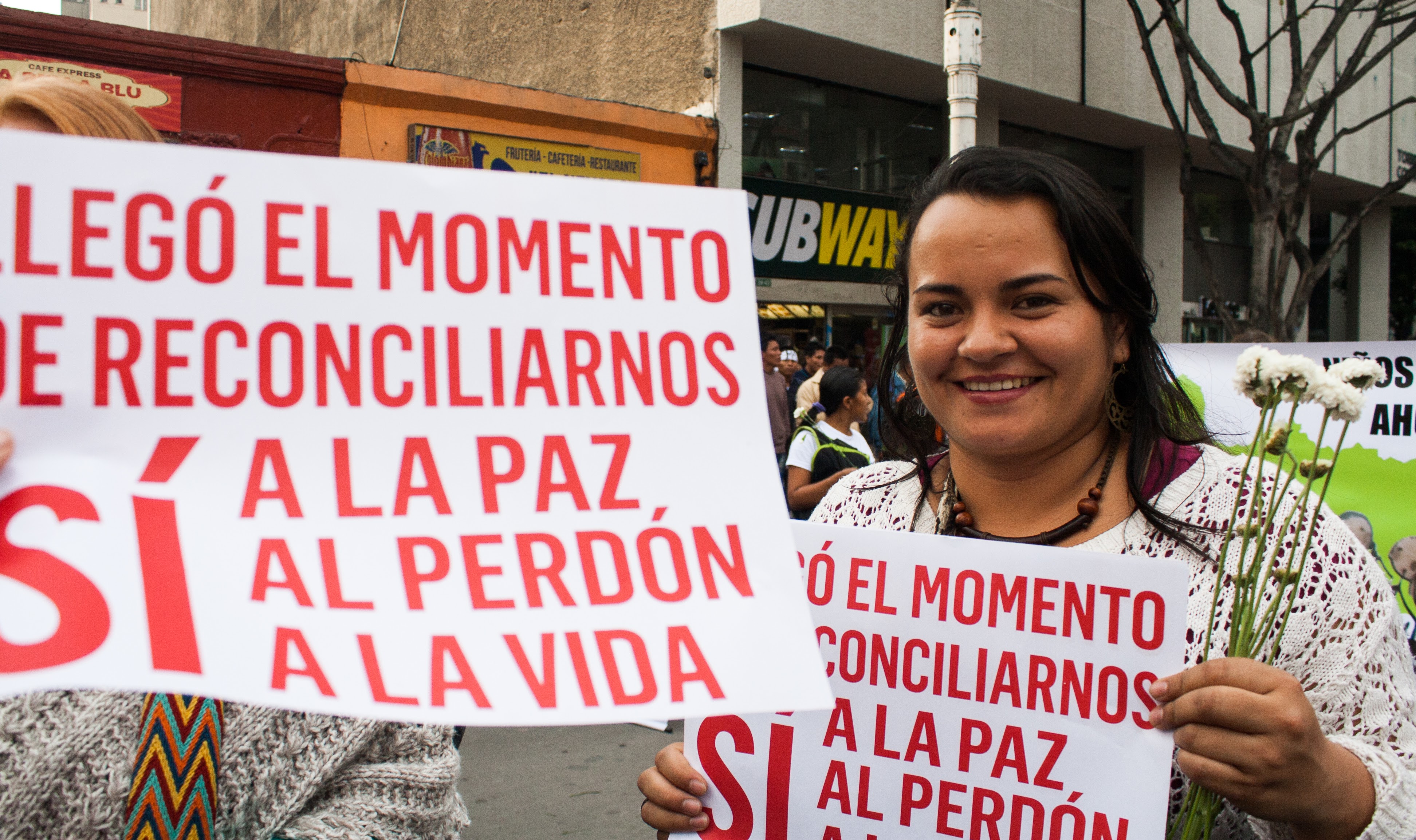 Carolina Perez, MCC Colombia worker and member of a Mennonite Brethren Church in Bogotá participates in a march in Bogota to demand peace accords after the plebiscite. Anna Vogt.